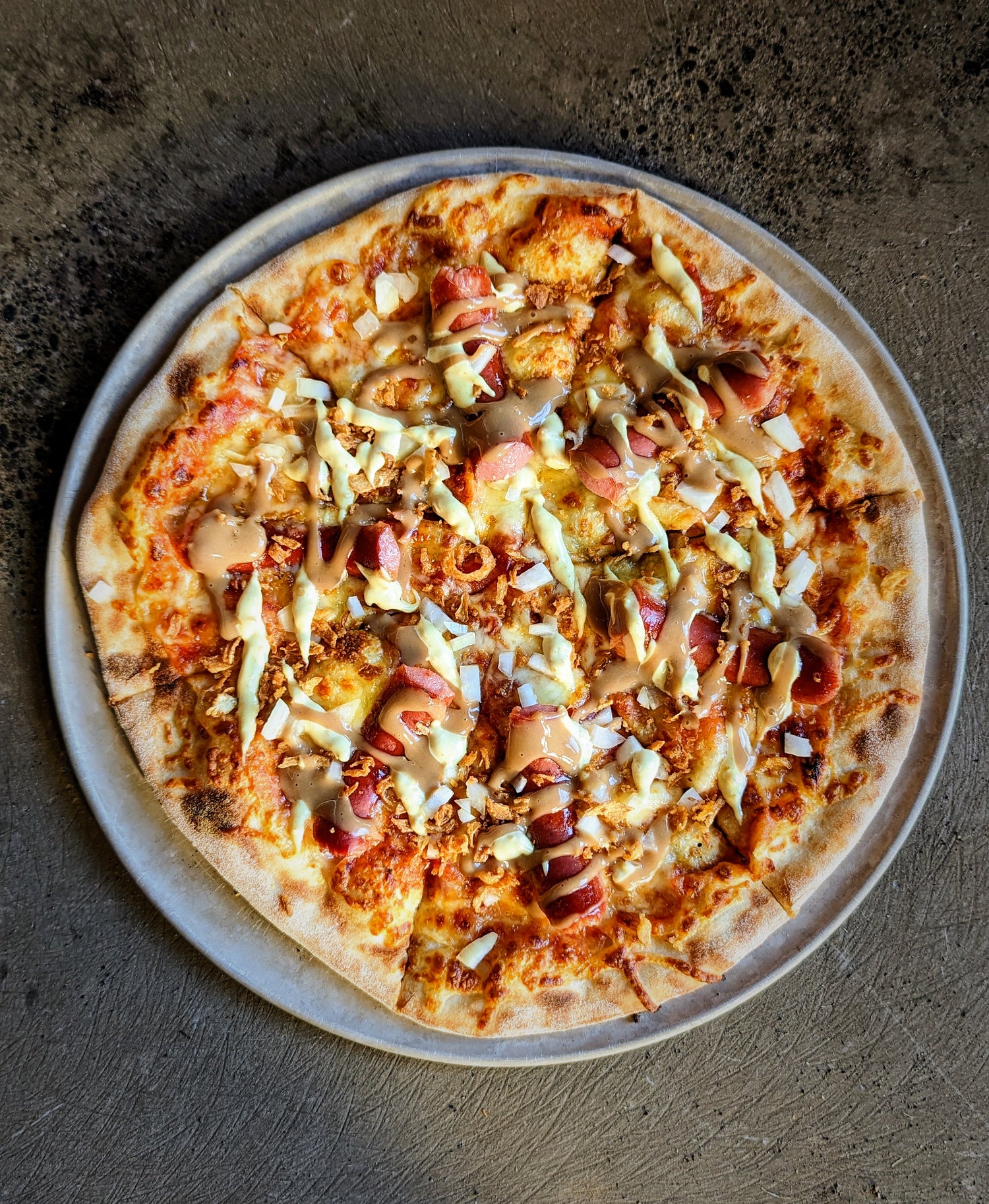 Eina pølse pizzu takk!
